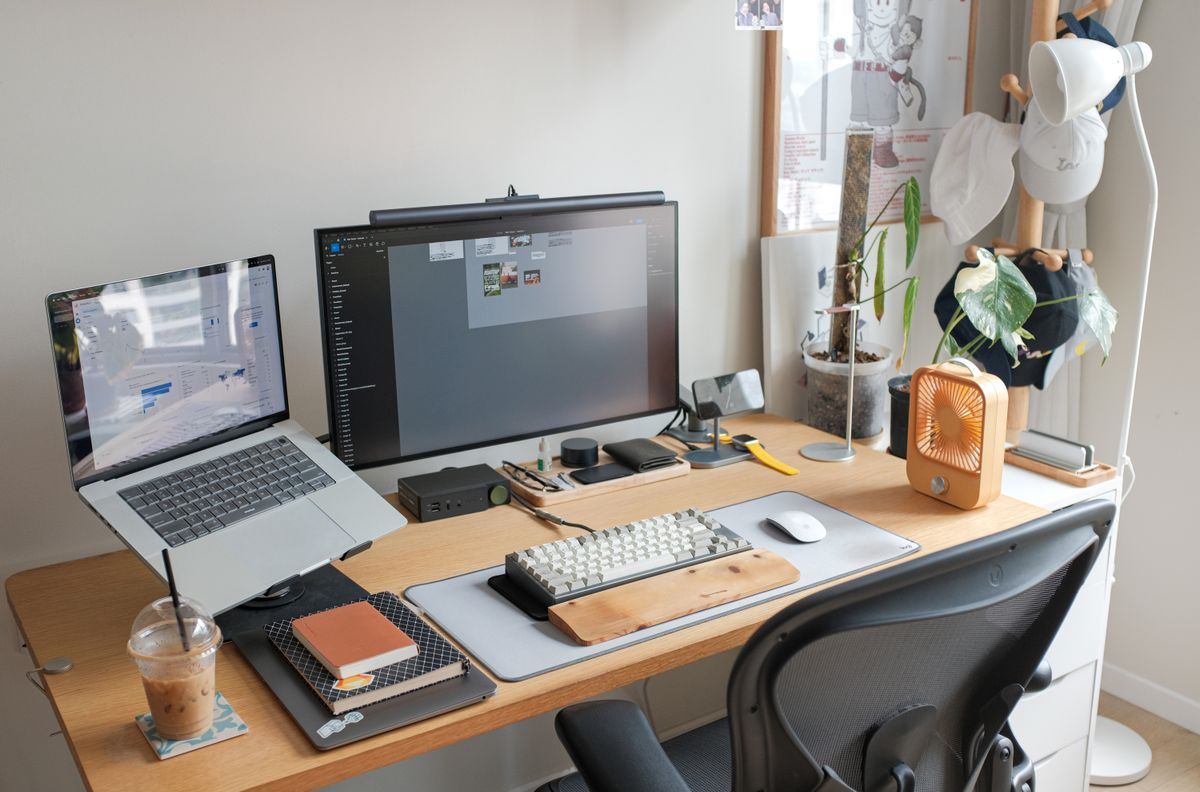 Laptop and monitor on a tidy design workspace